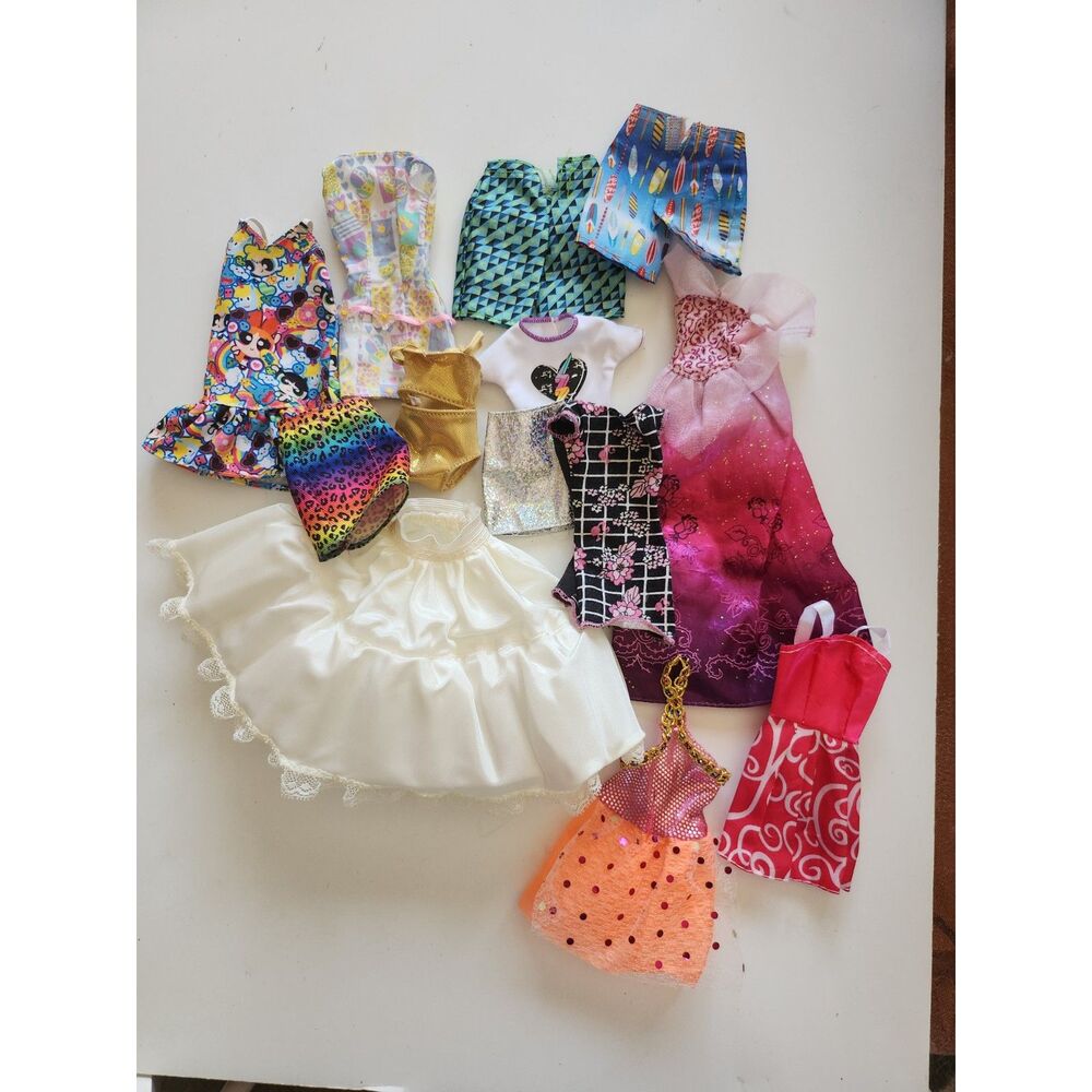 13 Barbie/Ken doll clothing pieces B24